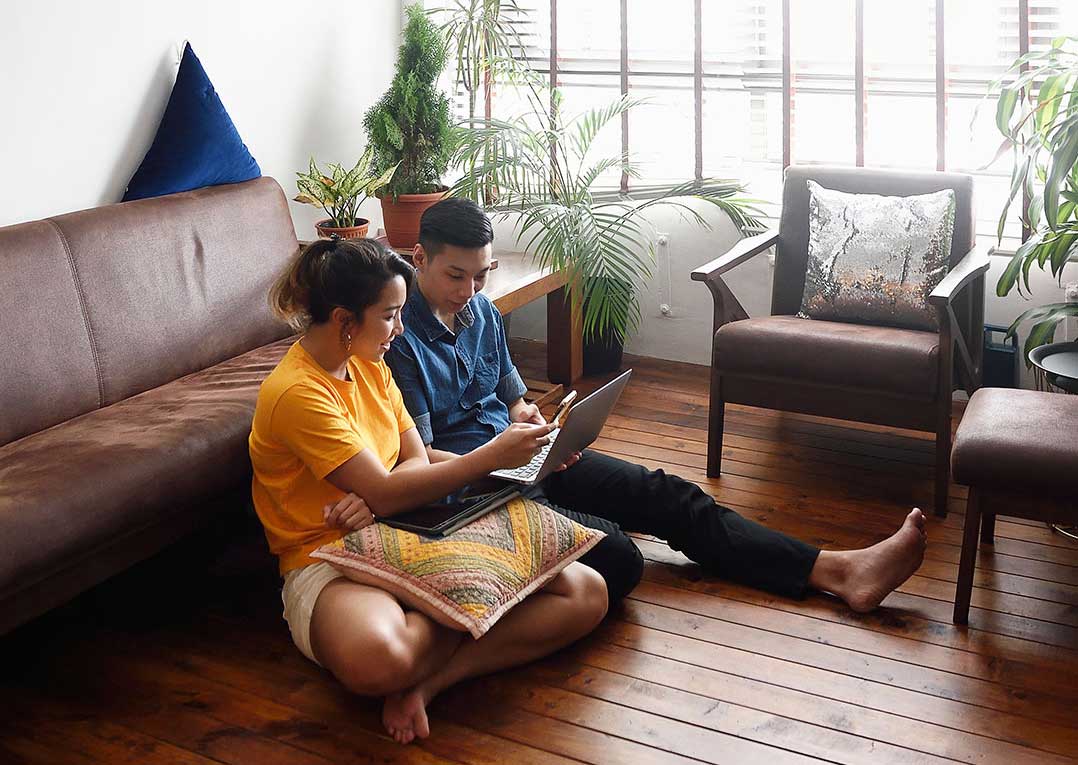 Couple looking at computer | Singlife Singapore