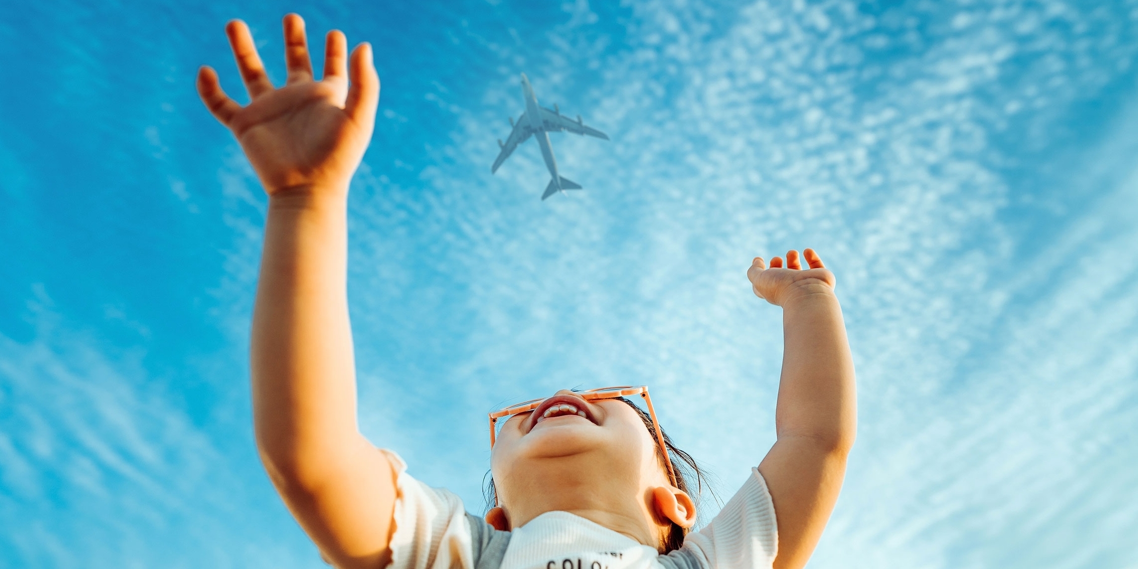 Toddler looking up in the sky